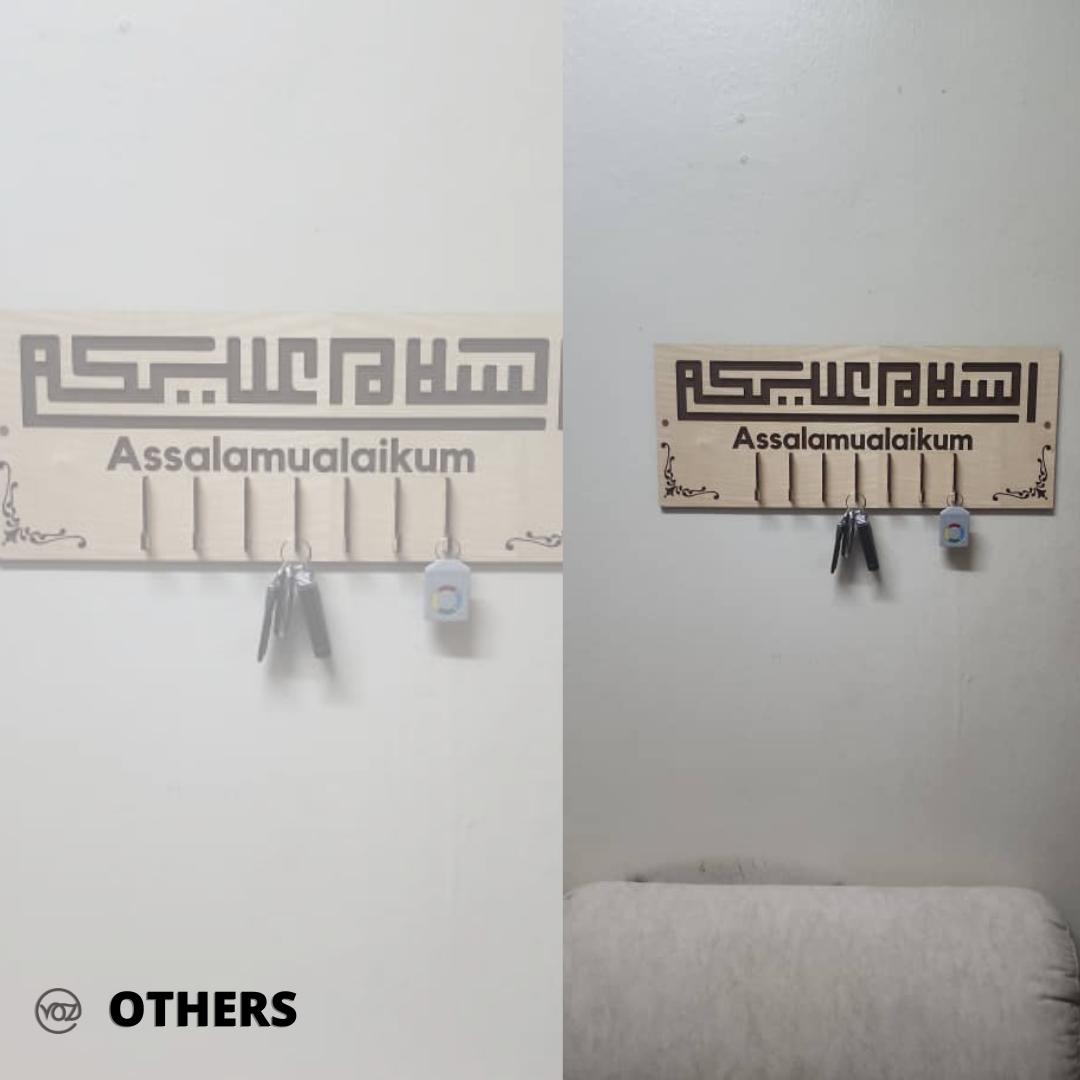 Two identical wall hooks with 'Assalamualaikum' text on a white wall, labeled 'Others'.